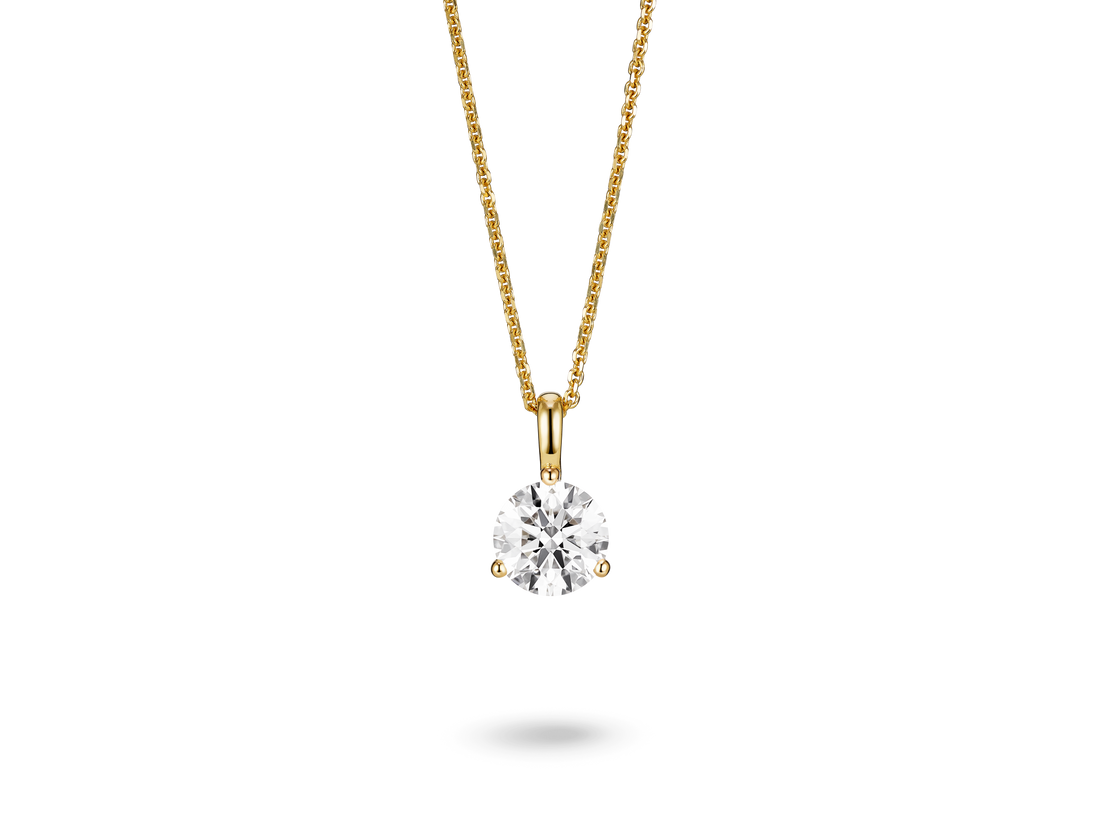 Front view of a lab-grown 1 carat round brilliant solitaire on a bale pendant in yellow gold